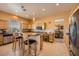 Bright kitchen with granite counters, stainless appliances, and breakfast bar seating at 442 Beardsley Cir, Henderson, NV 89052