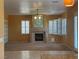 Spacious living room featuring a fireplace and large windows for ample natural light at 442 Beardsley Cir, Henderson, NV 89052