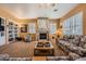 Cozy living room featuring a fireplace, built-in bookshelves, and ample seating at 442 Beardsley Cir, Henderson, NV 89052