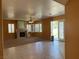 Open-concept living room featuring a fireplace and access to outdoor space at 442 Beardsley Cir, Henderson, NV 89052