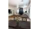 Bright living room with a fireplace, ceiling fan, and views from the dining table at 442 Beardsley Cir, Henderson, NV 89052