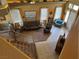 Open living room with leather sofas, large windows, and high ceilings at 442 Beardsley Cir, Henderson, NV 89052