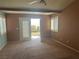 Bedroom leading to private balcony featuring bright door with plantation shutters at 442 Beardsley Cir, Henderson, NV 89052