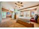 Expansive main bedroom with access to a bathroom, complemented by cozy carpeting at 442 Beardsley Cir, Henderson, NV 89052