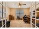 Office space with French doors, neutral carpet, and ample natural light from the shuttered window at 442 Beardsley Cir, Henderson, NV 89052