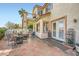 Charming patio with tile flooring, outdoor dining set, and built-in grill at 442 Beardsley Cir, Henderson, NV 89052