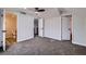 A comfortable carpeted bedroom offering easy access to adjacent rooms and a bathroom at 5129 Del Monte Ave, Las Vegas, NV 89146