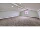 Spacious bonus room with neutral paint, carpeted flooring, and lots of light from a large window at 5129 Del Monte Ave, Las Vegas, NV 89146