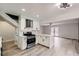 Open-concept kitchen with island, stainless appliances, white cabinetry, and bright lighting, with easy access to the living area at 5129 Del Monte Ave, Las Vegas, NV 89146