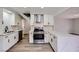 Modern kitchen featuring white cabinets, stainless steel appliances, and stylish countertops, creating a sleek culinary space at 5129 Del Monte Ave, Las Vegas, NV 89146