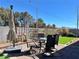 Outdoor dining area with a patio table, umbrella, and landscaped surroundings, perfect for enjoying meals outdoors at 5518 Stormy Night Ct, Las Vegas, NV 89120