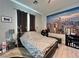 Bedroom with a queen sized bed and a scenic city scape wall mural at 5518 Stormy Night Ct, Las Vegas, NV 89120