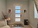 Inviting foyer with frosted glass door, stylish decor, and a glimpse of natural light at 5518 Stormy Night Ct, Las Vegas, NV 89120