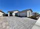 Charming single-story home featuring a three-car garage and paved driveway at 5518 Stormy Night Ct, Las Vegas, NV 89120