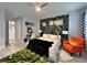 Beautifully decorated main bedroom with a fan and accent wall at 5518 Stormy Night Ct, Las Vegas, NV 89120