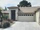 Charming single-story home featuring a well-manicured front yard and a two-car garage at 5709 Colwood Ln, Las Vegas, NV 89130