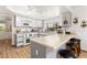 Efficient kitchen with white cabinets, sleek countertops, and modern appliances at 5709 Colwood Ln, Las Vegas, NV 89130