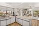 Functional kitchen featuring ample counter space, a breakfast bar, and natural light from windows at 5709 Colwood Ln, Las Vegas, NV 89130