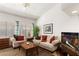 Cozy living room with comfortable seating, bright natural light, and a ceiling fan at 5709 Colwood Ln, Las Vegas, NV 89130