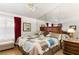 Relaxing bedroom with plush bedding, hardwood floors, and a stylish ensuite bathroom at 5709 Colwood Ln, Las Vegas, NV 89130