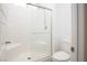 Bathroom with a glass shower door, tiled shower and white toilet at 600 N Carriage Hill Dr # 2174, Las Vegas, NV 89138