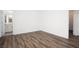 Spacious bedroom featuring modern flooring and a connecting bathroom at 600 N Carriage Hill Dr # 2174, Las Vegas, NV 89138