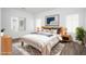 A beautifully staged bedroom featuring neutral tones, natural light, and hardwood floors at 600 N Carriage Hill Dr # 2174, Las Vegas, NV 89138
