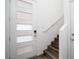 Inviting entryway featuring a stylish door and staircase with wood-look flooring at 600 N Carriage Hill Dr # 2174, Las Vegas, NV 89138