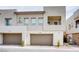 Contemporary townhouse featuring private two-car garage and a second-story balcony at 600 N Carriage Hill Dr # 2174, Las Vegas, NV 89138