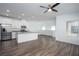 Spacious living area featuring wood floors, recessed lighting, and modern kitchen at 600 N Carriage Hill Dr # 2174, Las Vegas, NV 89138