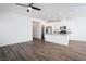 Bright living space featuring wood floors, white walls, and modern kitchen area at 600 N Carriage Hill Dr # 2174, Las Vegas, NV 89138