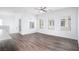 Bright, spacious living room with three windows and modern ceiling fan at 600 N Carriage Hill Dr # 2174, Las Vegas, NV 89138
