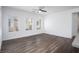 Large living room with abundant natural light, ceiling fan and wood-look flooring at 600 N Carriage Hill Dr # 2174, Las Vegas, NV 89138