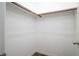 Empty walk-in closet with a wooden hanging rod and wood-look flooring at 600 N Carriage Hill Dr # 2174, Las Vegas, NV 89138