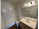 Bright bathroom features a shower/tub combo and a large mirror over the vanity at 601 Cabrillo Cir # 970, Henderson, NV 89015