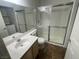 Bathroom with shower stall, toilet, and vanity with a sink with a laundry machine in the background at 601 Cabrillo Cir # 970, Henderson, NV 89015