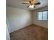Cozy bedroom offers natural light with a ceiling fan and neutral carpet at 601 Cabrillo Cir # 970, Henderson, NV 89015