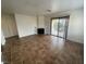 Bright living room featuring tiled floors, fireplace, and a sliding door to the balcony at 601 Cabrillo Cir # 970, Henderson, NV 89015
