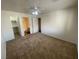 Spacious main bedroom with carpet, ceiling fan, walk-in closet and en-suite bath at 601 Cabrillo Cir # 970, Henderson, NV 89015