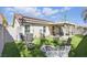 Backyard features a fire pit, artificial turf, and a covered patio connected to the house at 6312 Monarch Creek St, Las Vegas, NV 89130