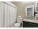 Cozy bathroom featuring a toilet, shower with curtain, and vanity with granite countertops at 6312 Monarch Creek St, Las Vegas, NV 89130