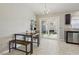 Bright dining area with modern light fixture and sliding glass door to backyard at 6312 Monarch Creek St, Las Vegas, NV 89130
