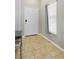 Bright entryway showcasing neutral walls, tile flooring, and a white front door at 6312 Monarch Creek St, Las Vegas, NV 89130