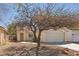 Charming single-story home features a xeriscaped front yard with an attached two-car garage at 6312 Monarch Creek St, Las Vegas, NV 89130