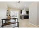 Open kitchen featuring dark cabinets, stainless steel appliances, and tile flooring at 6312 Monarch Creek St, Las Vegas, NV 89130