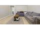 Large living room with vaulted ceilings, comfortable seating and tile floors at 6312 Monarch Creek St, Las Vegas, NV 89130