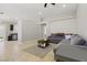 Open-concept living area featuring neutral walls and tile floors, perfect for entertaining guests at 6312 Monarch Creek St, Las Vegas, NV 89130