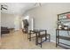 Bright open-concept living space with tile flooring, a ceiling fan, and recessed lighting at 6312 Monarch Creek St, Las Vegas, NV 89130
