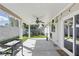 Covered patio with ceiling fan, outdoor lighting, and concrete flooring extends into the backyard at 6312 Monarch Creek St, Las Vegas, NV 89130