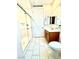 Bright bathroom featuring tile flooring, shower with glass enclosure, and modern vanity at 6436 Linden St, North Las Vegas, NV 89086